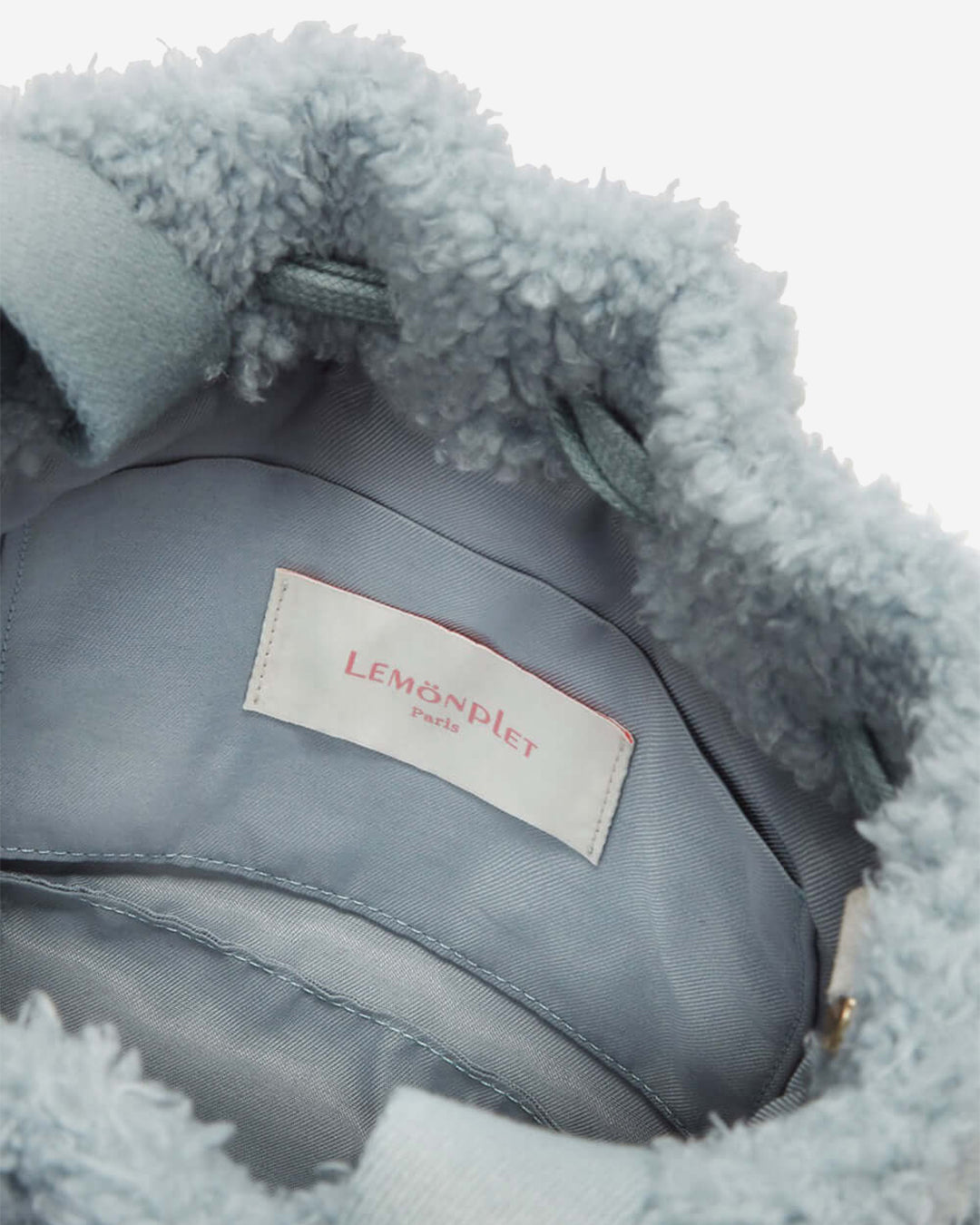 [SIGNATURE LINE] FAUX FUR BÉNÉ BUCKET BAG